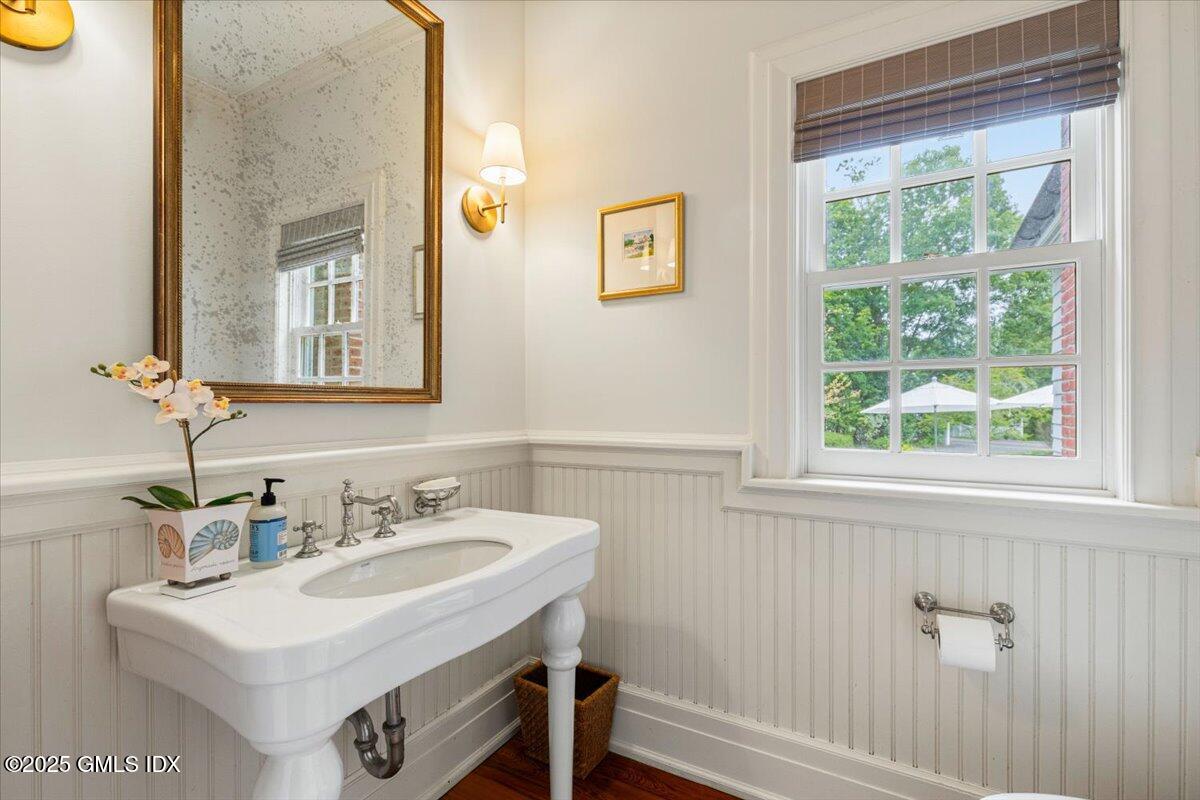 203 Riverside Avenue Riverside, CT 06878 - Photo 32 of 40 a bathroom with a sink and a mirror