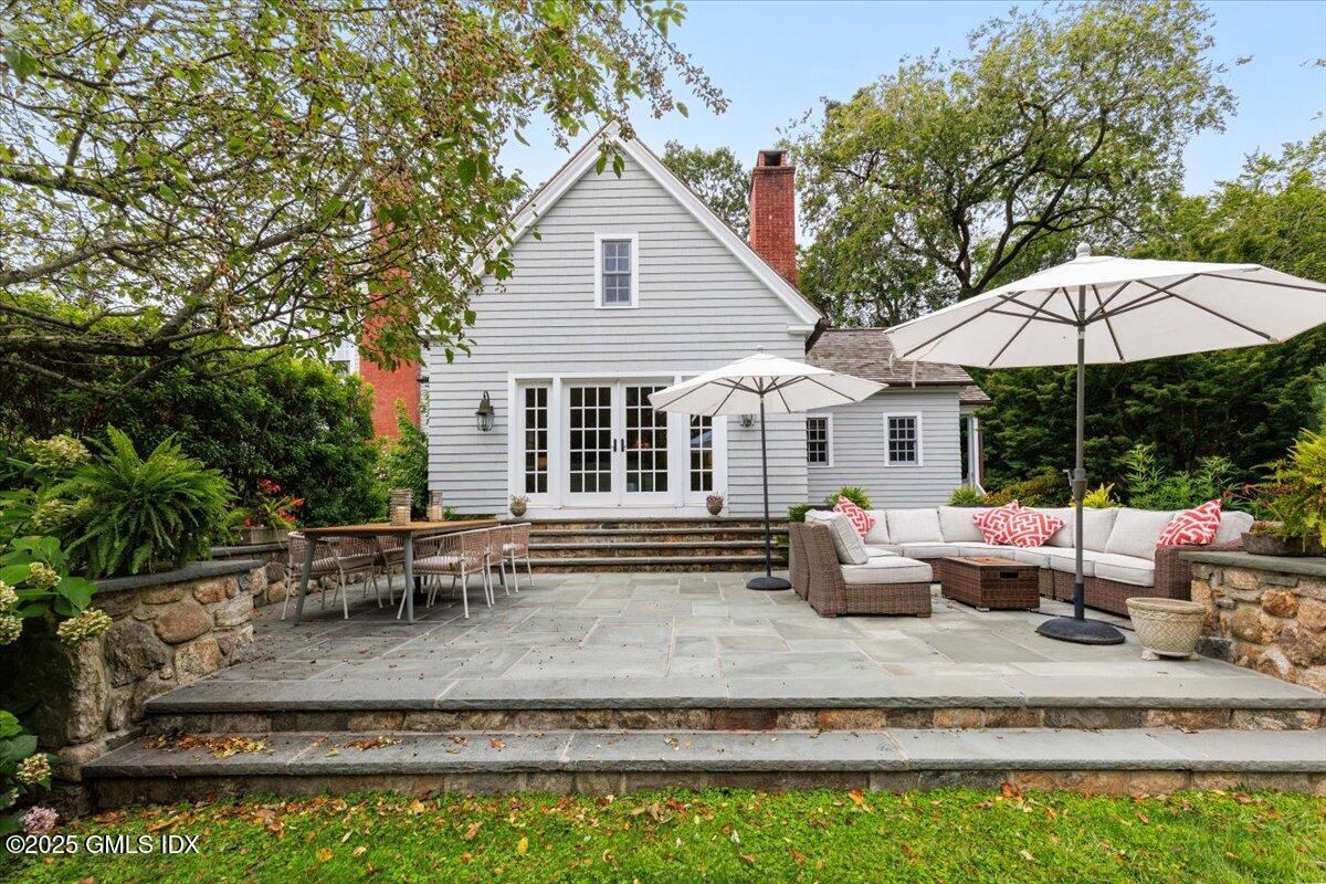 203 Riverside Avenue Riverside, CT 06878 - Photo 35 of 40 a backyard of a house with yard fire pit and outdoor seating