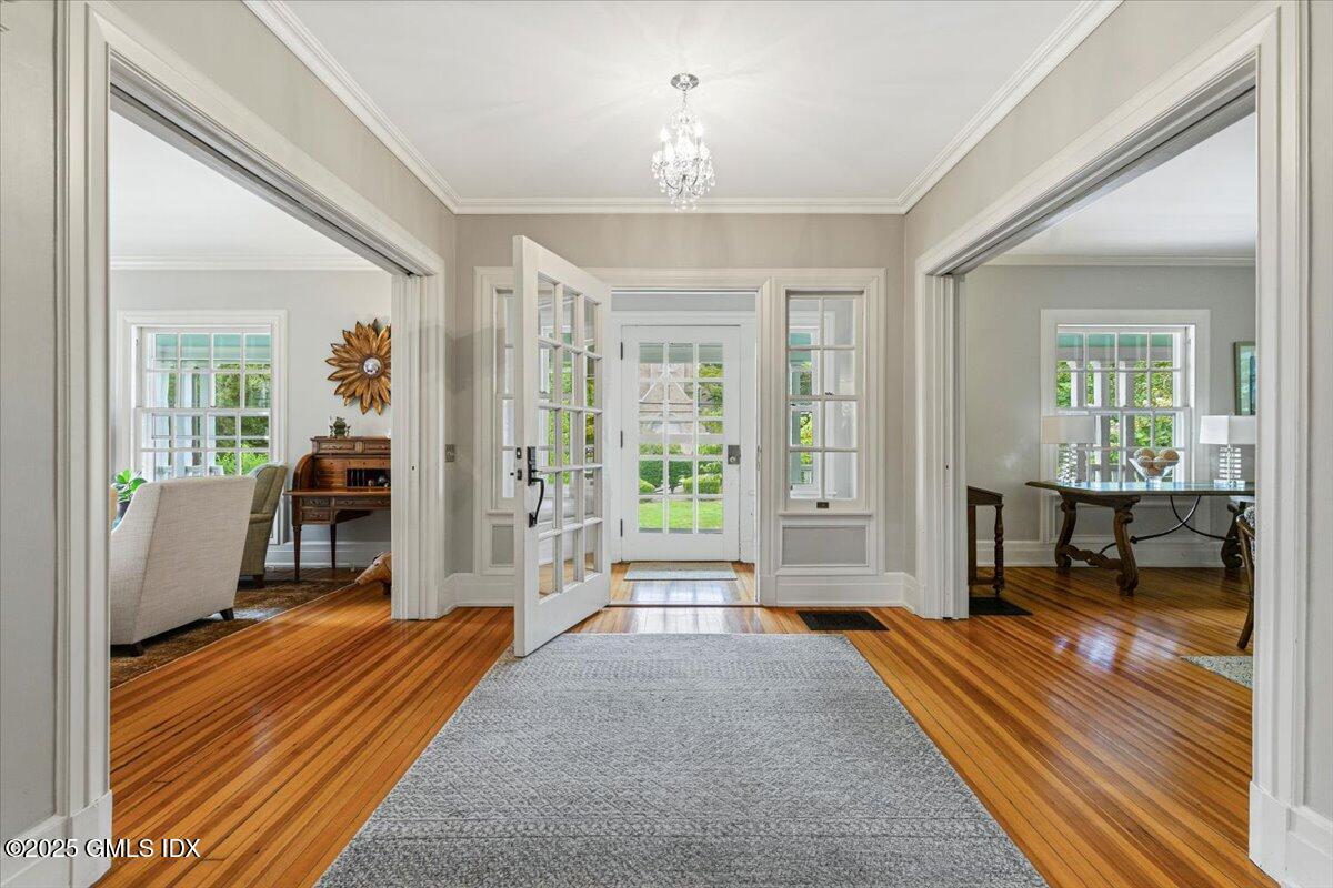 203 Riverside Avenue Riverside, CT 06878 - Photo 6 of 40 a living room with a bed furniture and a window