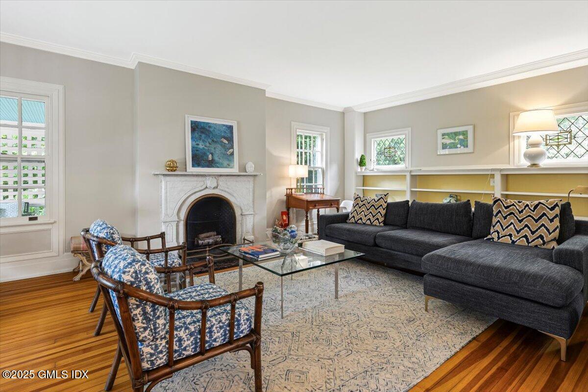 203 Riverside Avenue Riverside, CT 06878 - Photo 8 of 40 a living room with furniture a fireplace and a window
