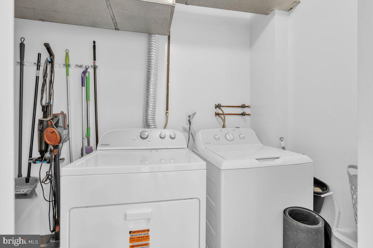 46202 Delaire Landing Road, Unit 202 Philadelphia, PA 19114 - Photo 13 of 34 a utility room with dryer and washer