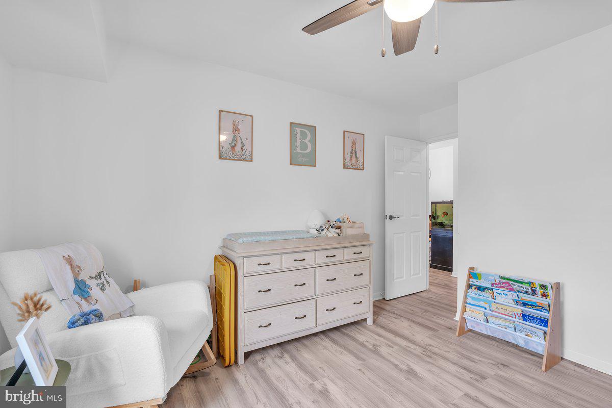 46202 Delaire Landing Road, Unit 202 Philadelphia, PA 19114 - Photo 16 of 34 a bedroom with furniture and a wooden floor