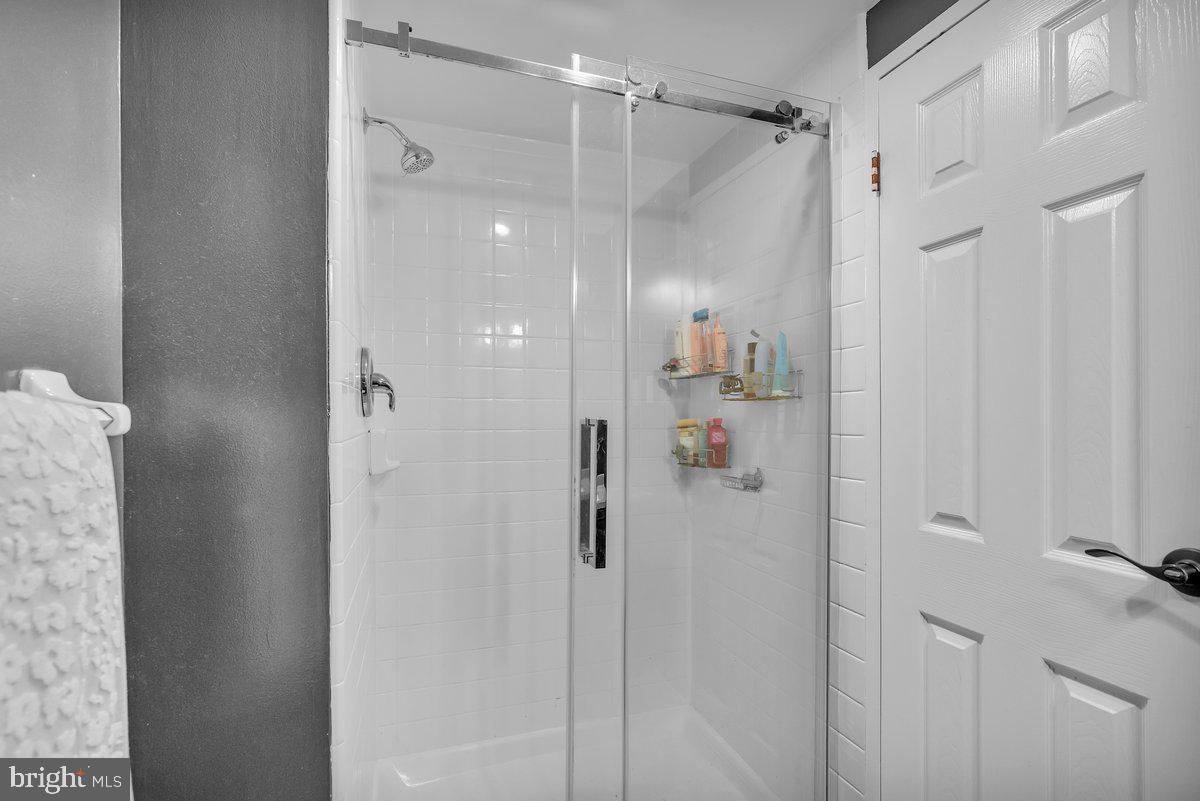 46202 Delaire Landing Road, Unit 202 Philadelphia, PA 19114 - Photo 22 of 34 a bathroom with a shower