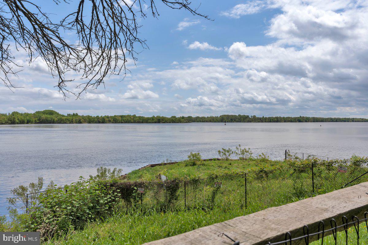 46202 Delaire Landing Road, Unit 202 Philadelphia, PA 19114 - Photo 27 of 34 a view of a lake with houses in the back yard