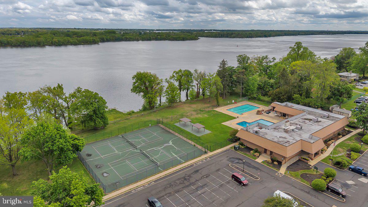 46202 Delaire Landing Road, Unit 202 Philadelphia, PA 19114 - Photo 29 of 34 a view of a lake with a yard