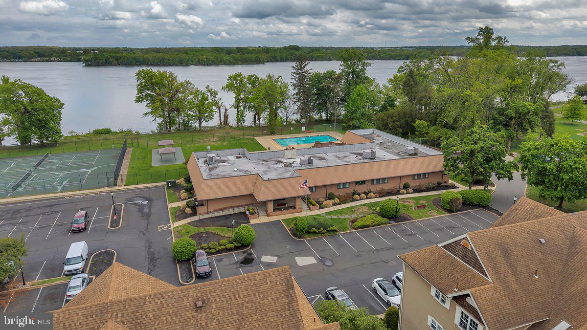 46202 Delaire Landing Road, Unit 202 Philadelphia, PA 19114 - Photo 31 of 34 an aerial view of a house with a garden and lake view