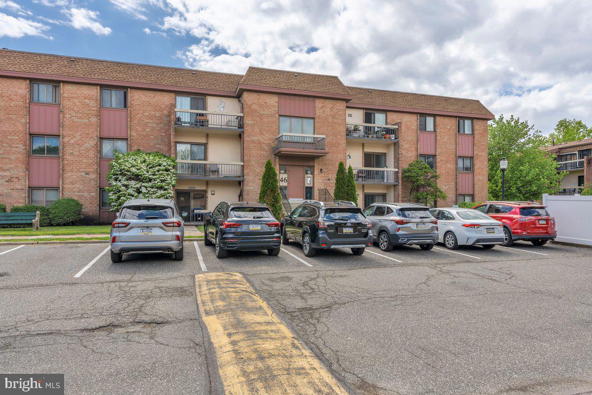 46202 Delaire Landing Road, Unit 202 Philadelphia, PA 19114 - Photo 34 of 34 a view of a cars in front of a building