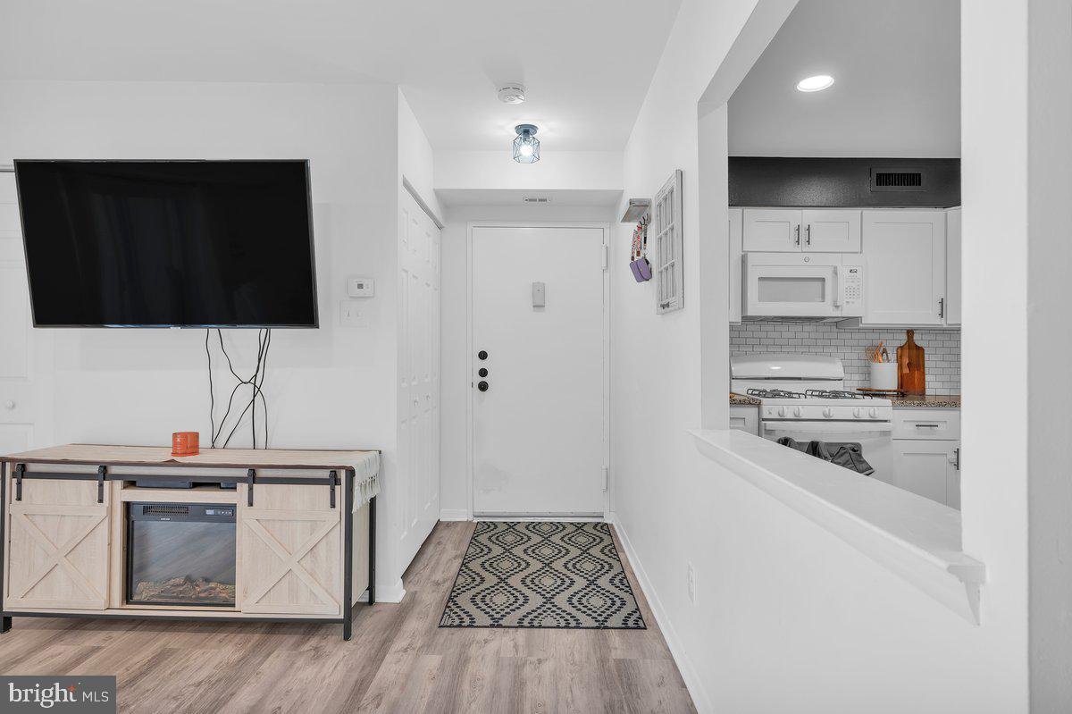 46202 Delaire Landing Road, Unit 202 Philadelphia, PA 19114 - Photo 5 of 34 a kitchen with a sink and a stove top oven