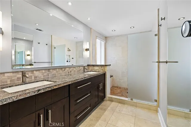 a view of a chair and table in the balcony