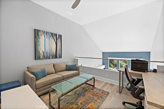 a view of living room with furniture and a staircase