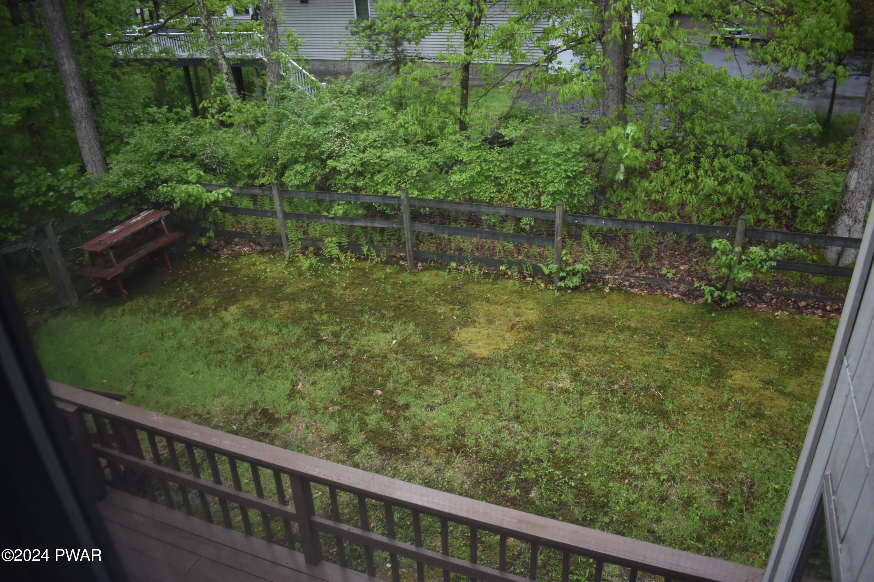 115 Rodeo Lane Hawley, PA 18428 - Photo 24 of 38 a balcony with trees in front of it