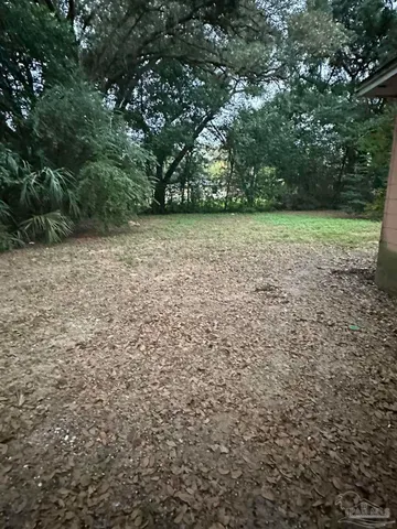 a view of outdoor space with deck and yard