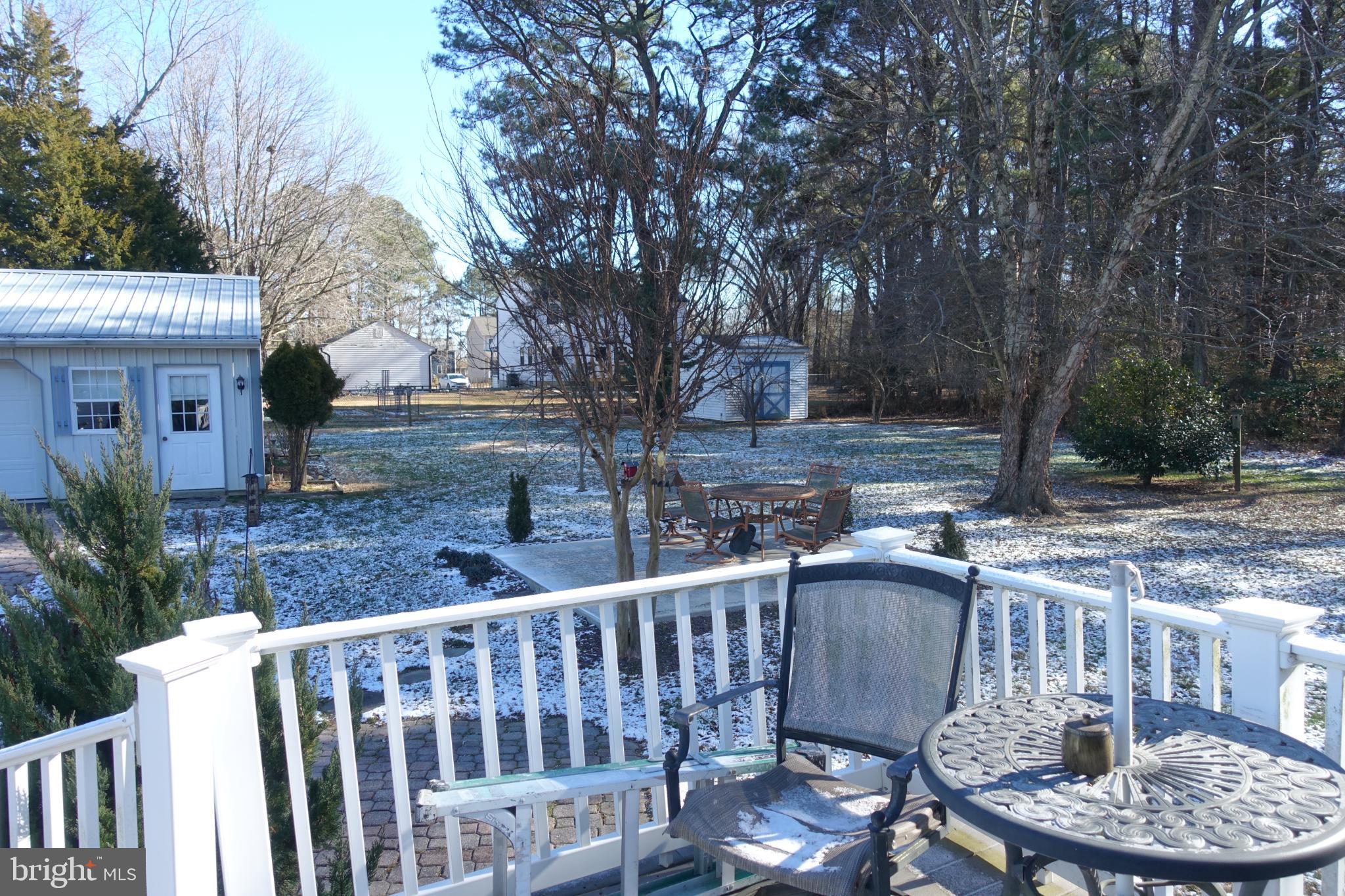 109 Carroll Road Stevensville, MD 21666 - Photo 5 of 9 Back deck overlooks spacious landscaped yard.