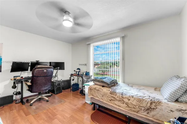 a bedroom with bed and a window