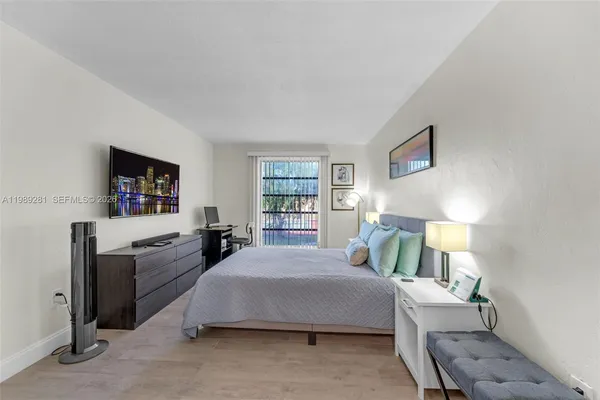 a bedroom with a bed and furniture