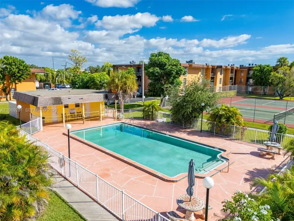 a view of a swimming pool with a patio