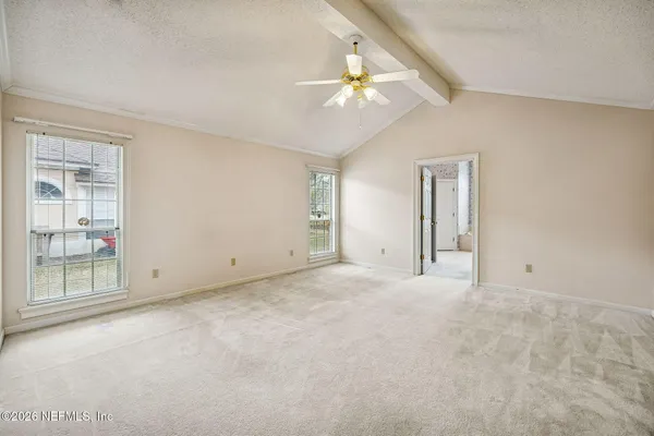 a view of an empty room with a window