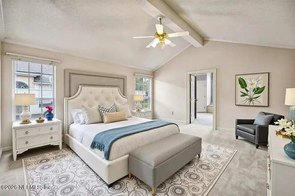 a bedroom with a bed and ceiling fan