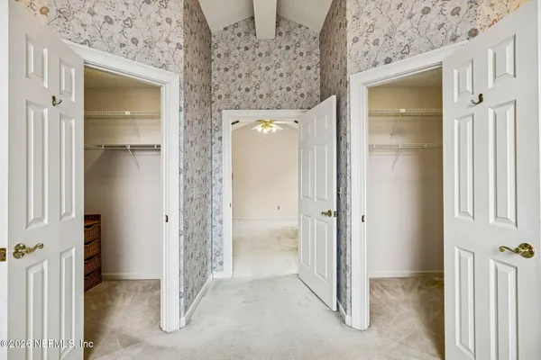 a view of a bathroom with a glass door shower and a sink