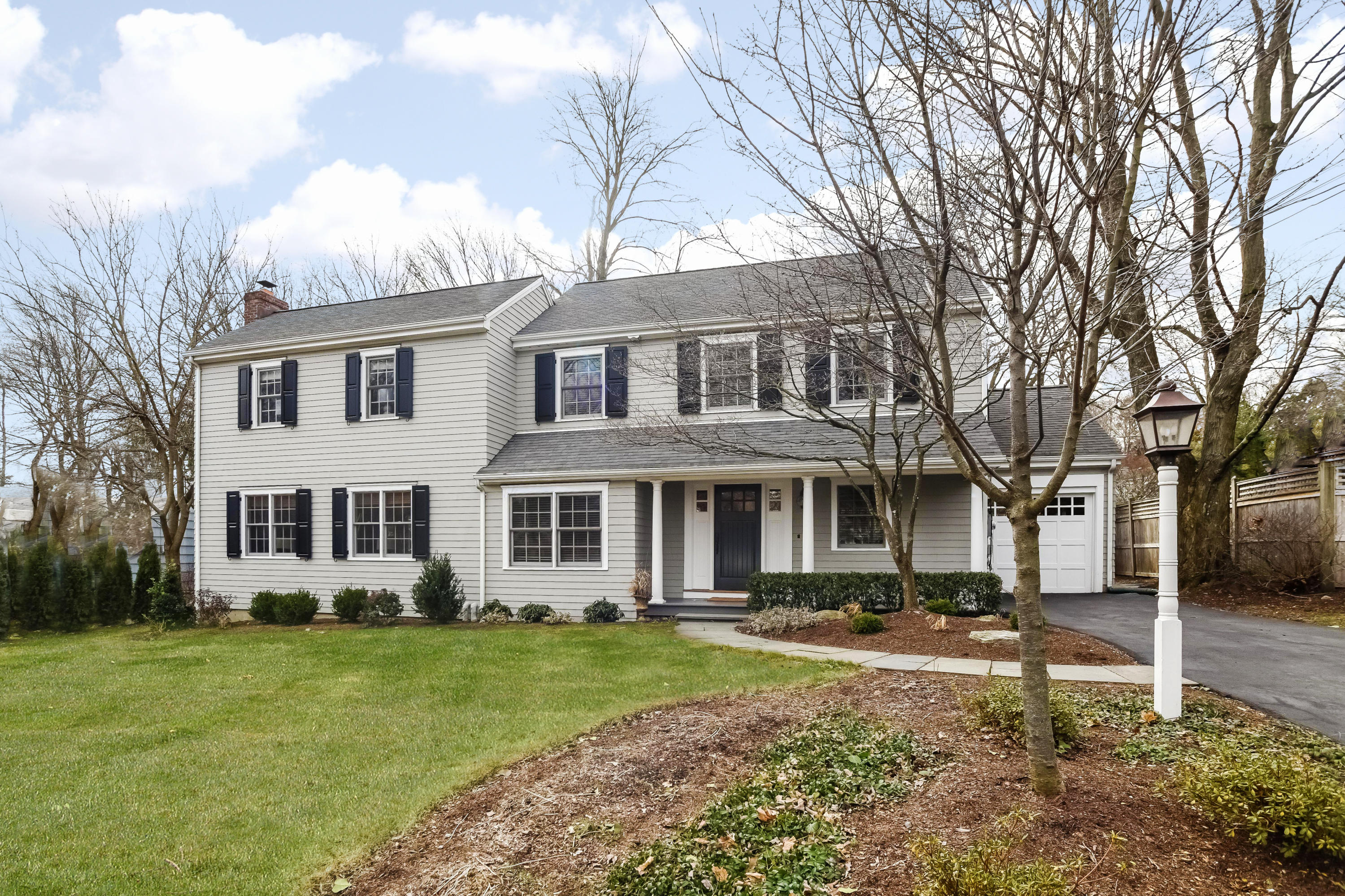 8 Laforge Road Darien, CT 06820 - Photo 1 of 34 a front view of a house with garden and trees