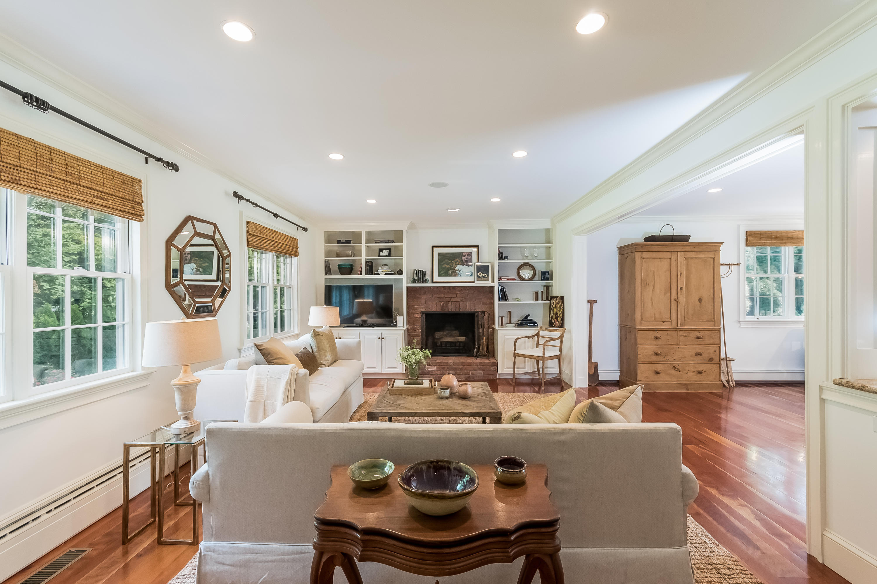 8 Laforge Road Darien, CT 06820 - Photo 18 of 34 a living room with fireplace furniture and a large window