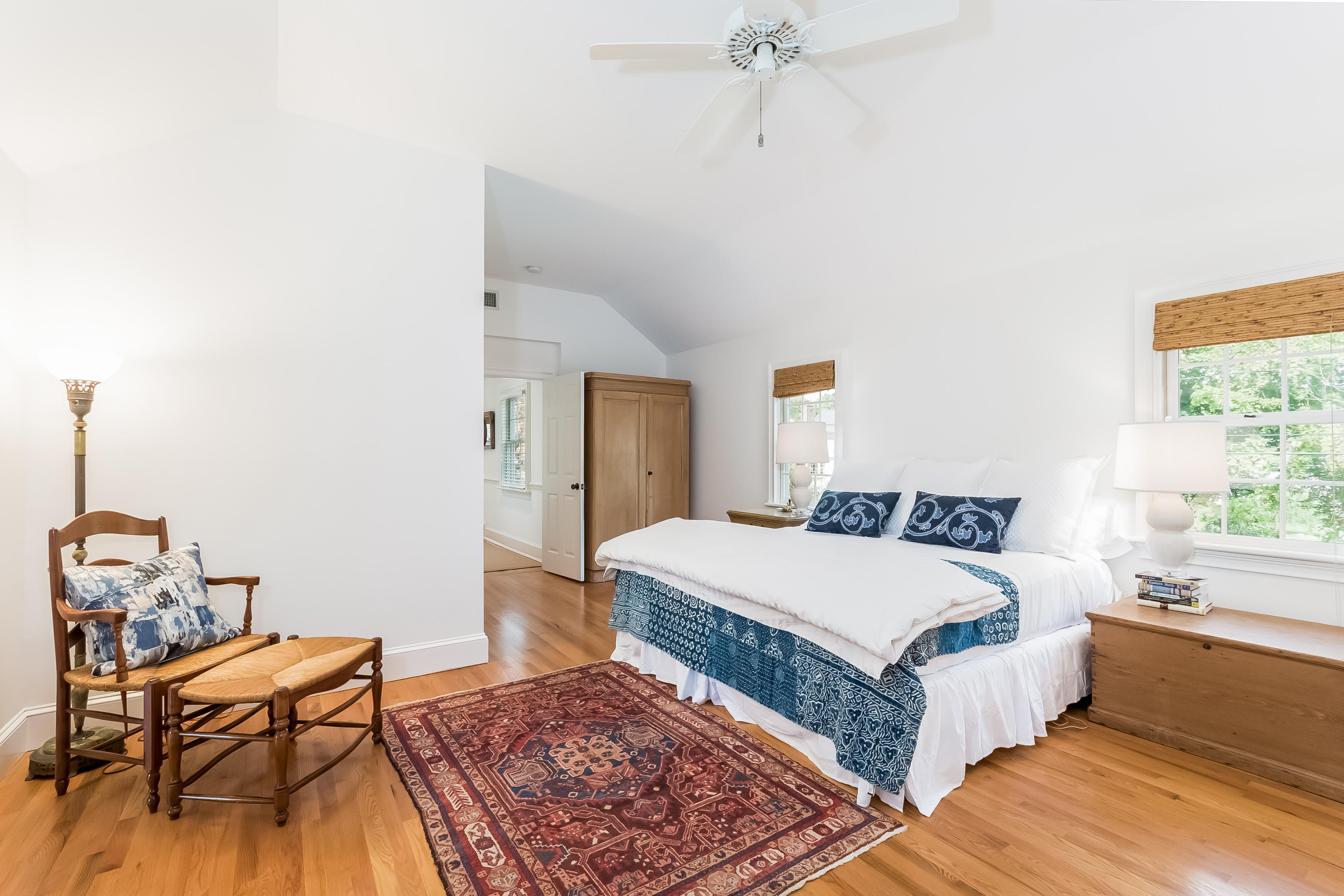 8 Laforge Road Darien, CT 06820 - Photo 21 of 34 a bedroom with a bed and wooden floor