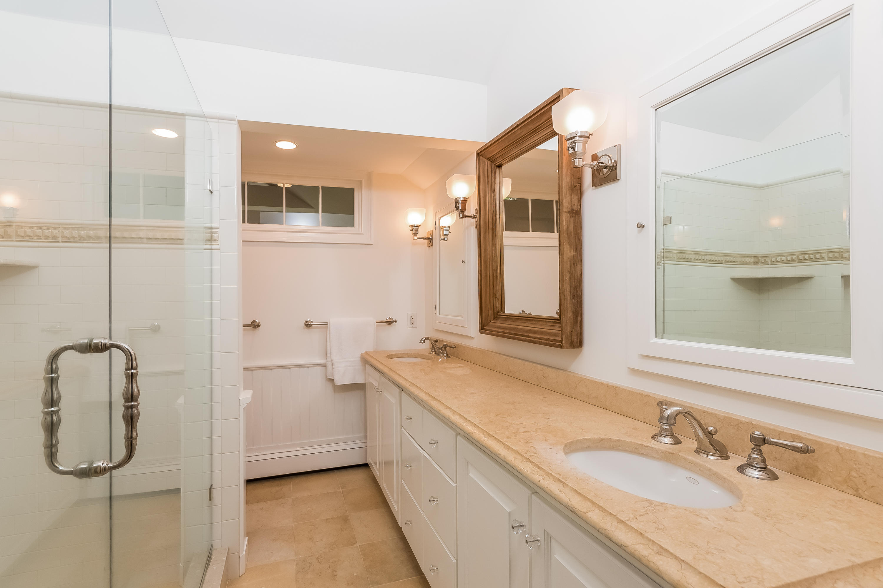 8 Laforge Road Darien, CT 06820 - Photo 23 of 34 a bathroom with a granite countertop sink and a mirror