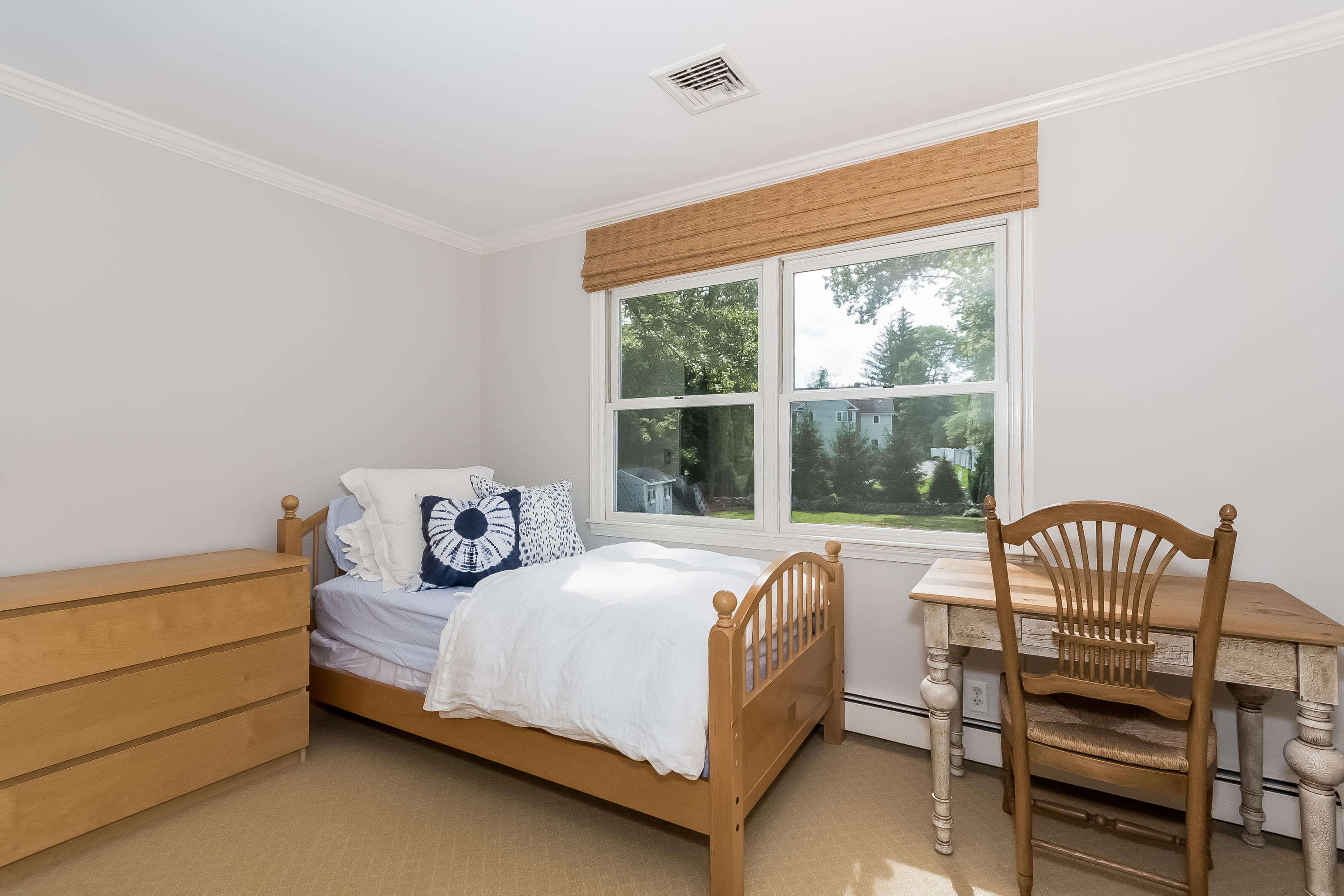 8 Laforge Road Darien, CT 06820 - Photo 28 of 34 a bedroom with a bed and a window