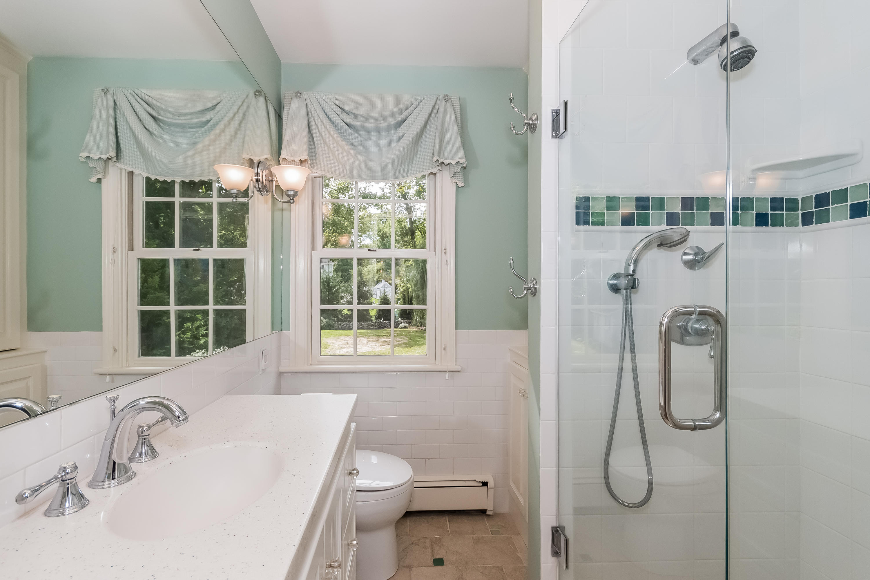 8 Laforge Road Darien, CT 06820 - Photo 29 of 34 a bathroom with a sink vanity mirror and toilet