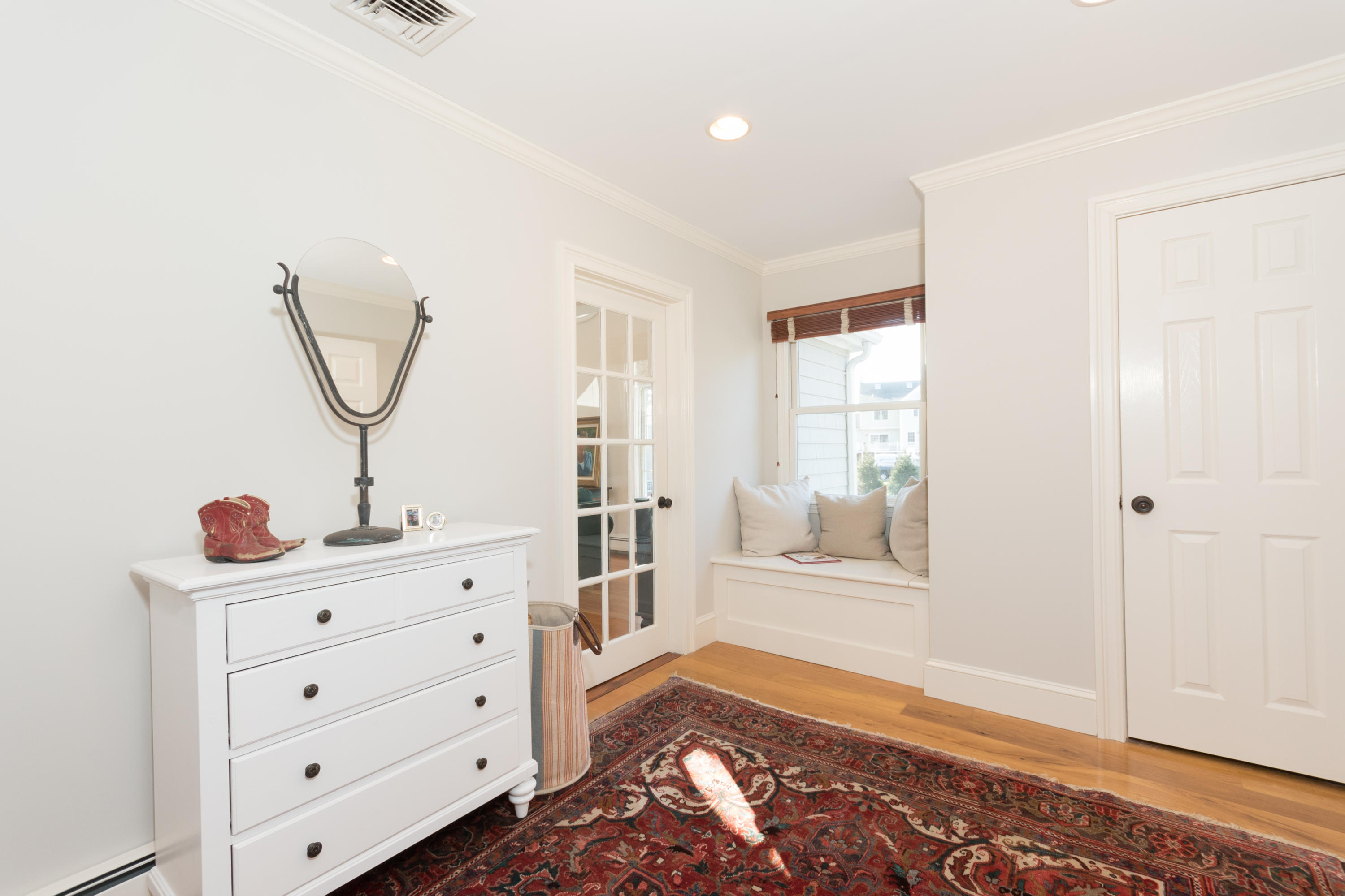 8 Laforge Road Darien, CT 06820 - Photo 31 of 34 a view of room with window and wooden floor