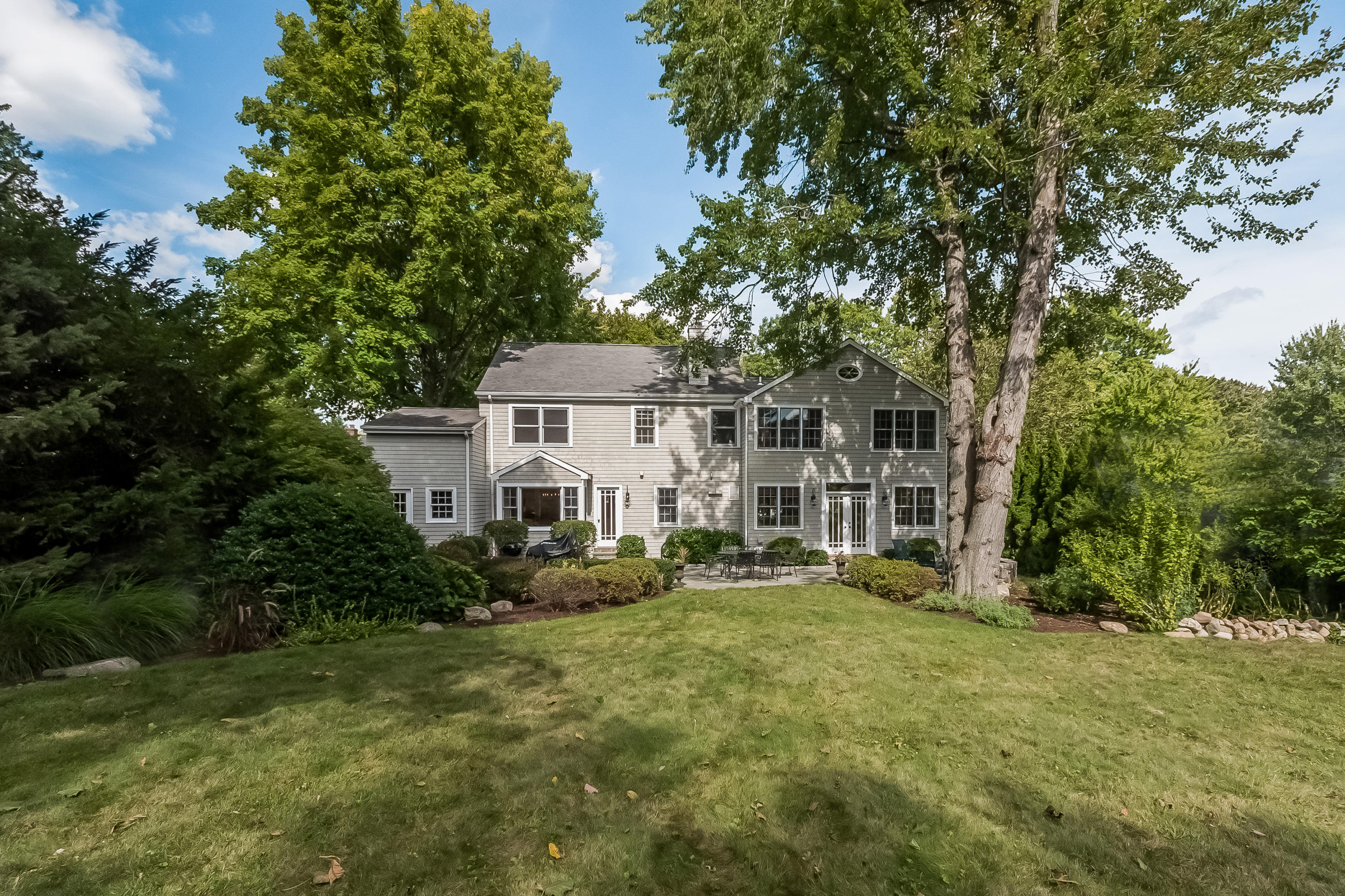 8 Laforge Road Darien, CT 06820 - Photo 5 of 34 a view of a house with garden and trees