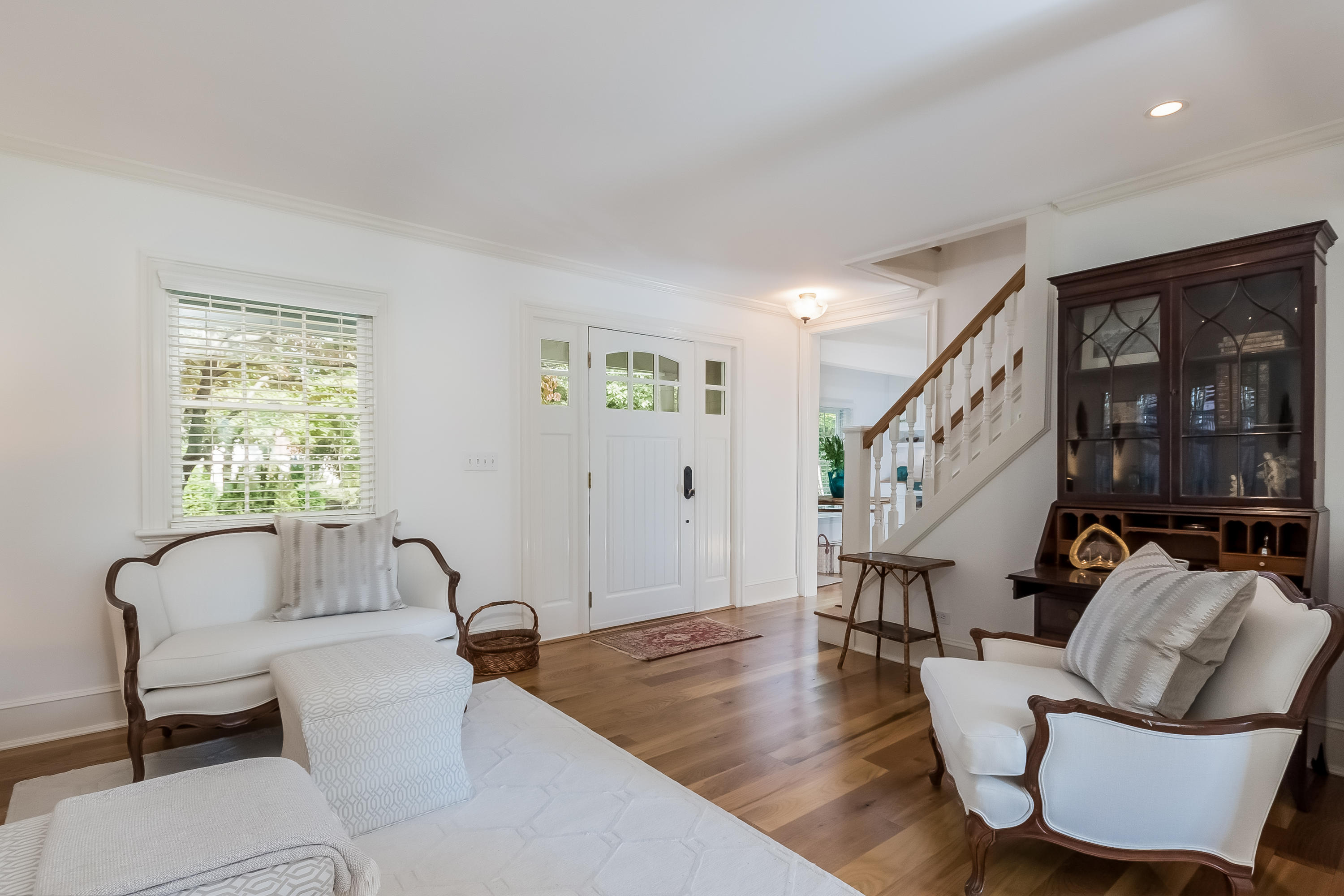 8 Laforge Road Darien, CT 06820 - Photo 8 of 34 a living room with furniture and a large window
