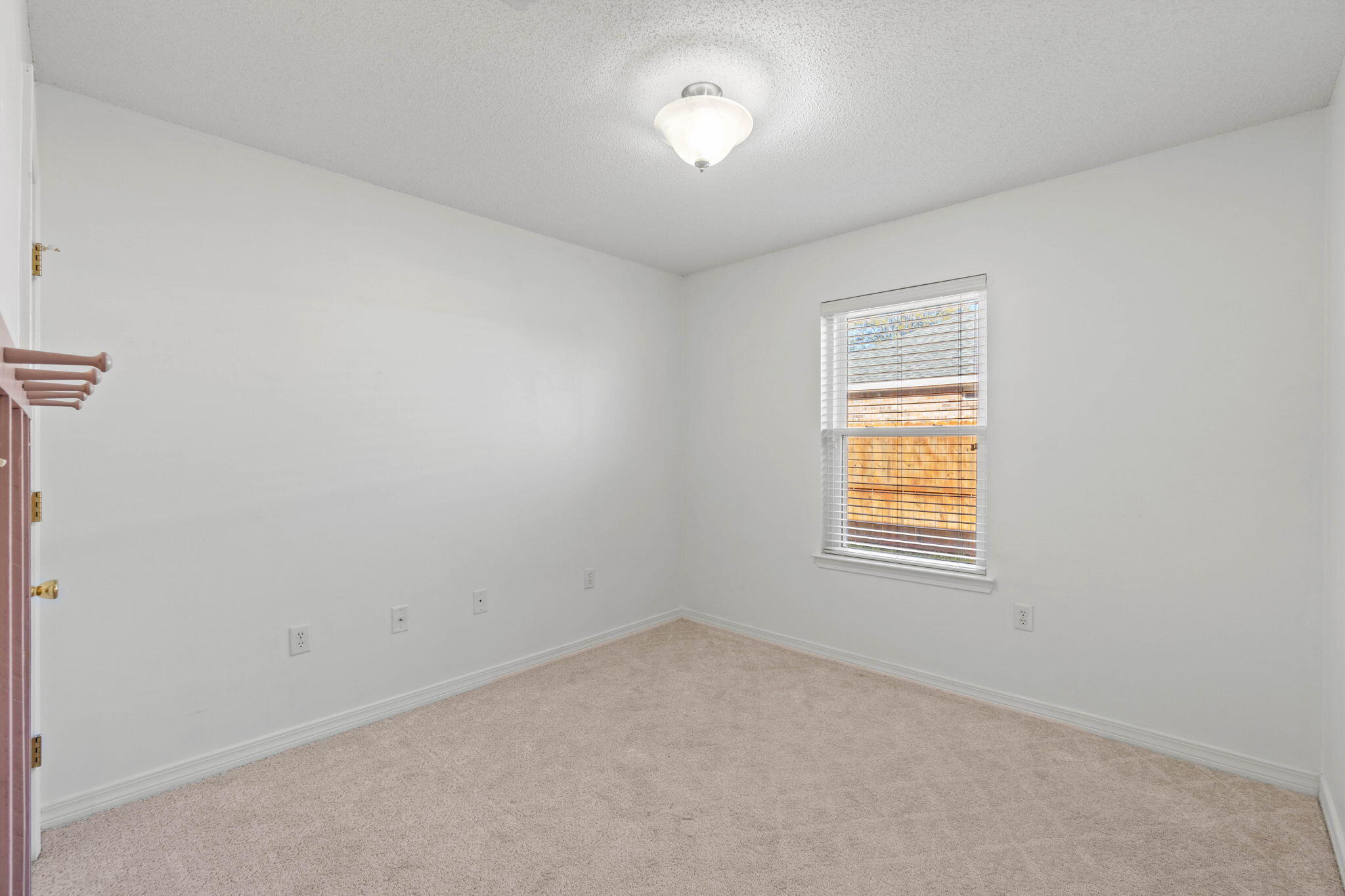3128 Border Creek Drive Crestview, FL 32539 - Photo 13 of 23 an empty room with a window