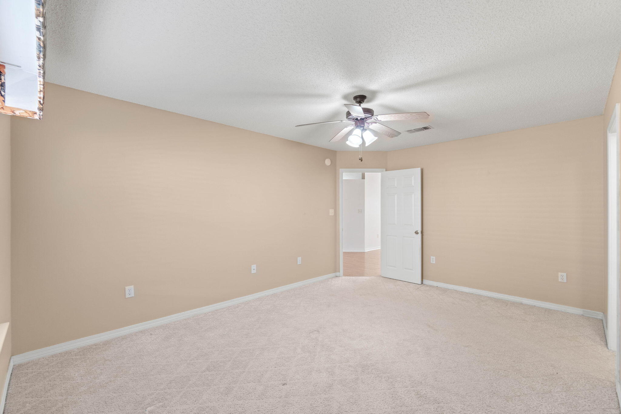 3128 Border Creek Drive Crestview, FL 32539 - Photo 18 of 23 a view of an empty room with a chandelier fan