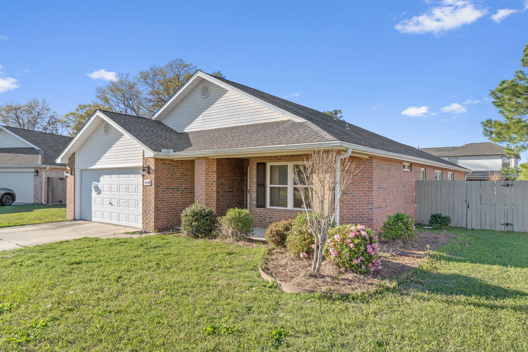 3128 Border Creek Drive Crestview, FL 32539 - Photo 2 of 23 a front view of a house with garden
