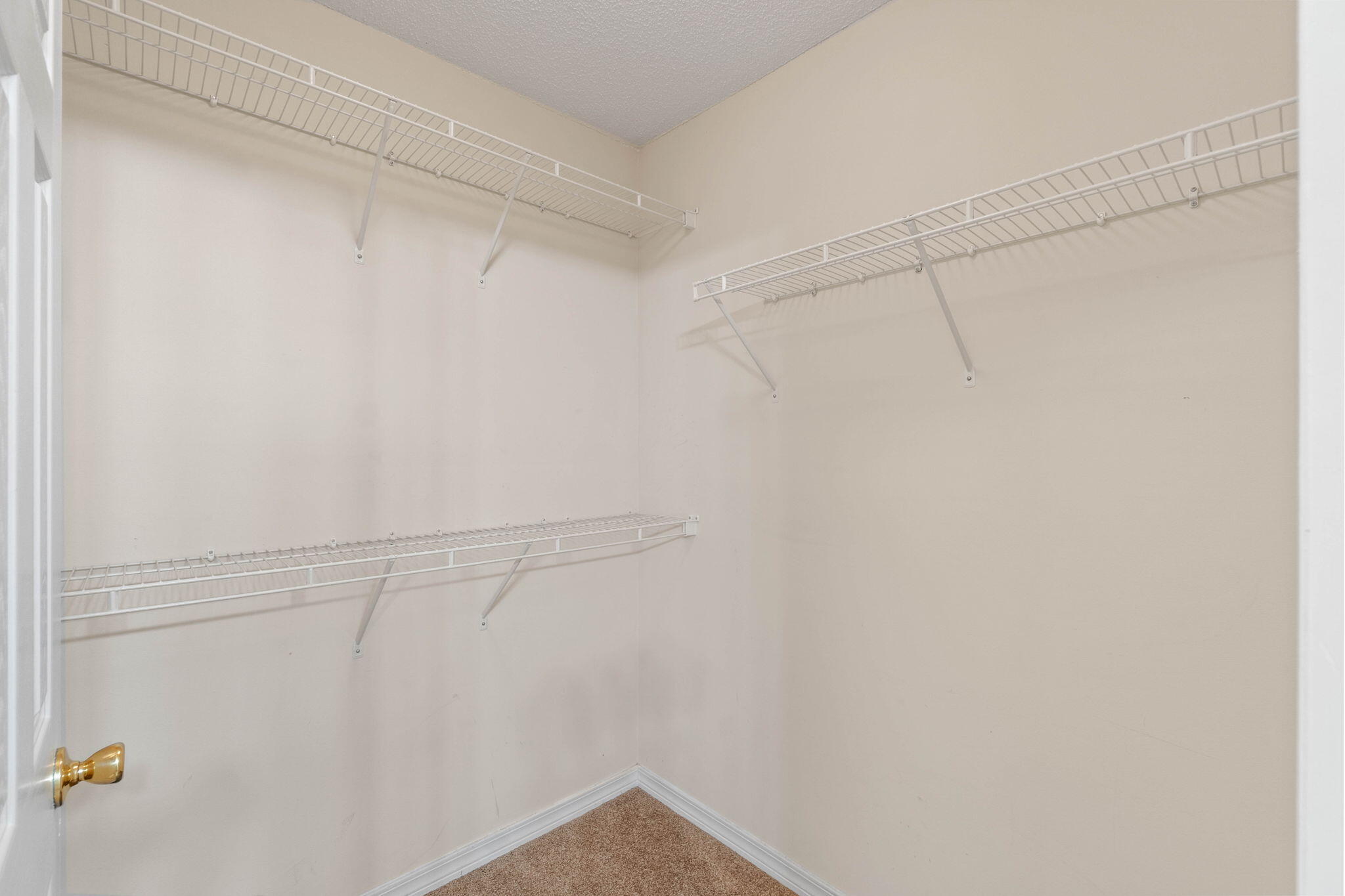 3128 Border Creek Drive Crestview, FL 32539 - Photo 21 of 23 a view of a room with racks on the wall