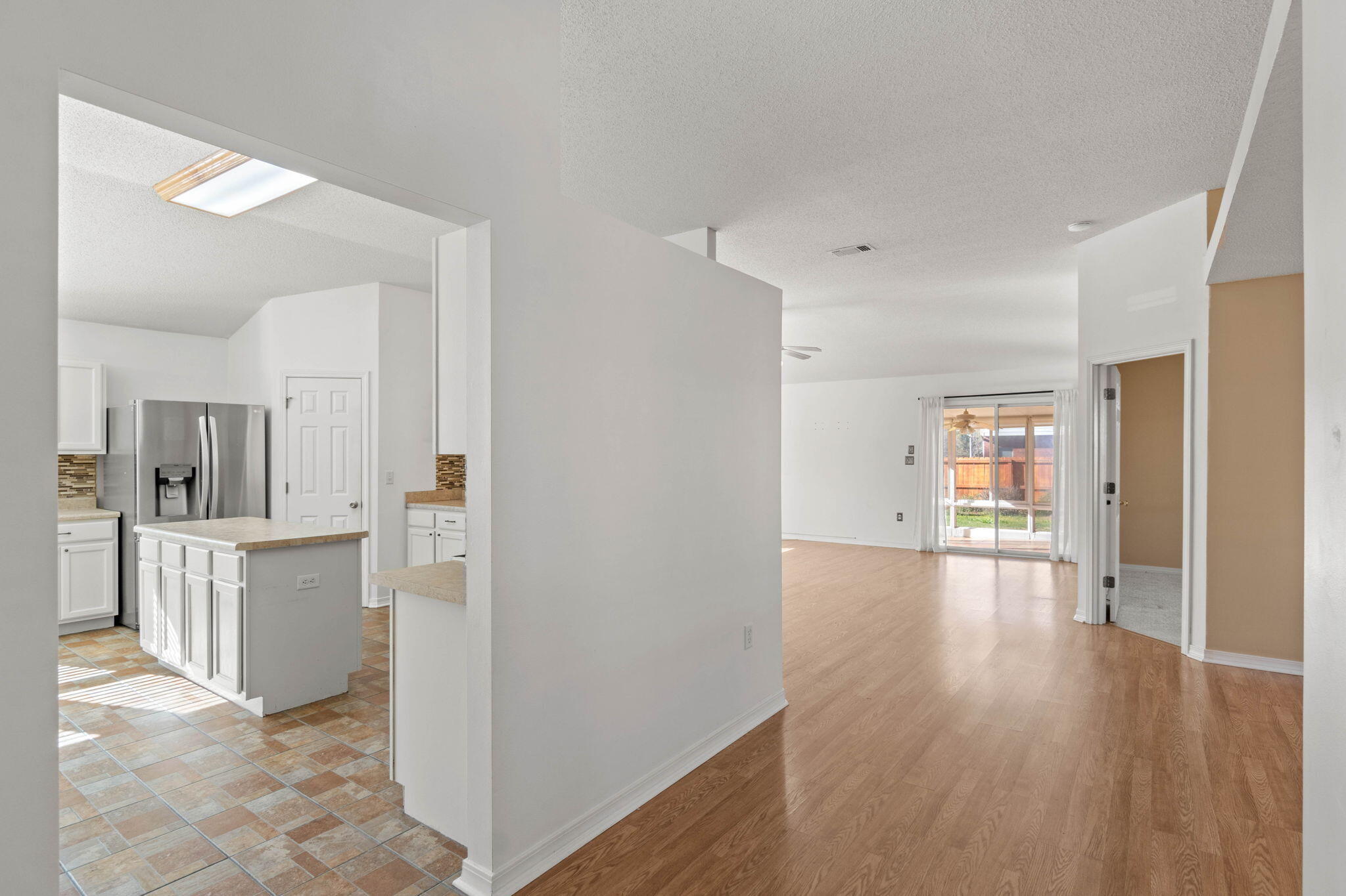 3128 Border Creek Drive Crestview, FL 32539 - Photo 4 of 23 a view of a kitchen with wooden floor a sink and dishwasher
