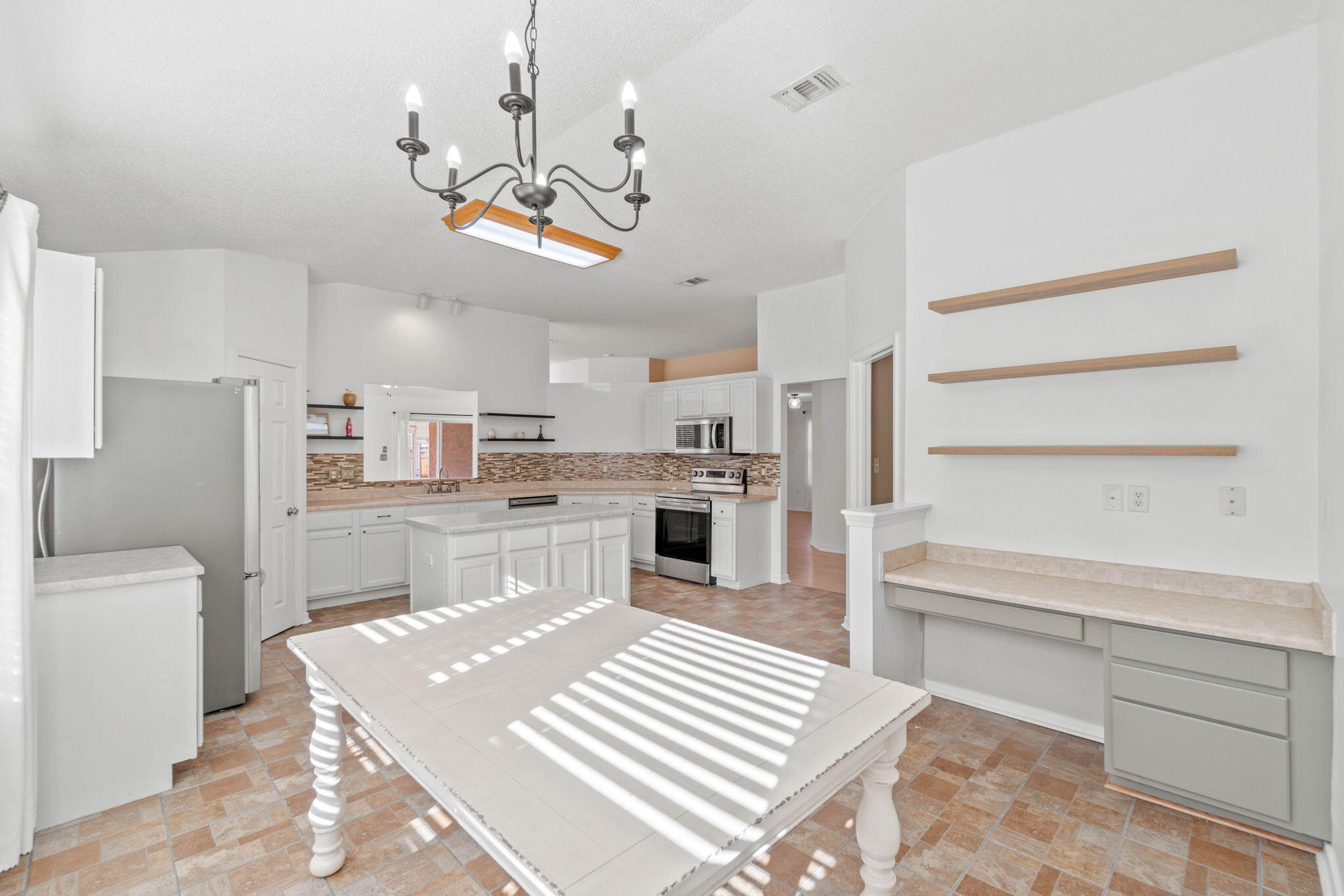3128 Border Creek Drive Crestview, FL 32539 - Photo 8 of 23 a view of kitchen with sink microwave and cabinets