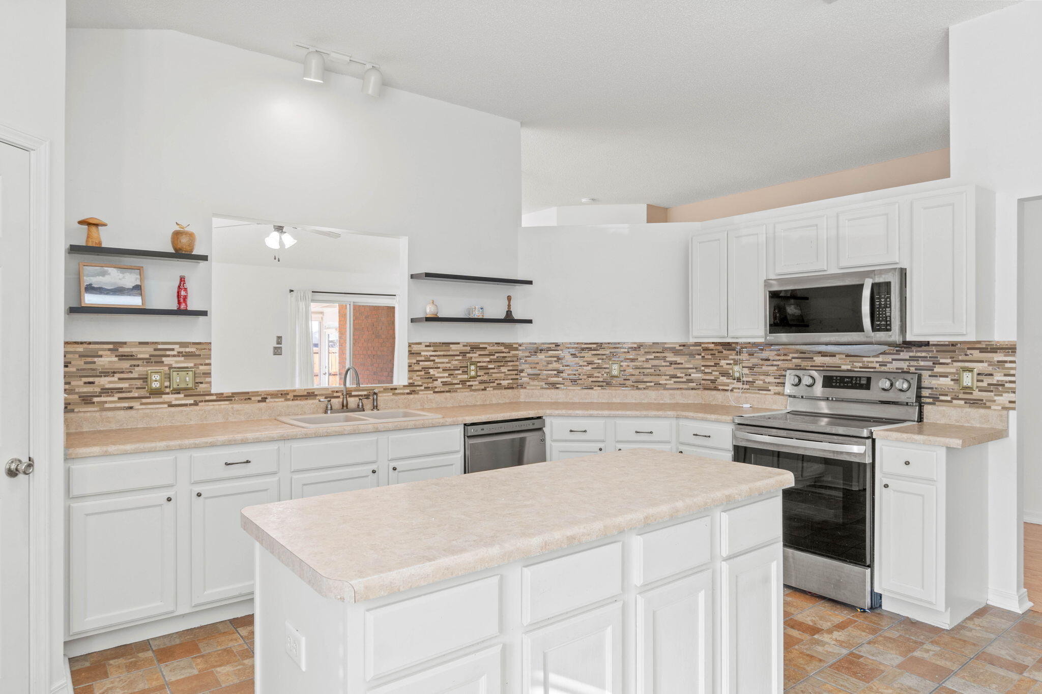 3128 Border Creek Drive Crestview, FL 32539 - Photo 9 of 23 a kitchen with a stove cabinets and microwave