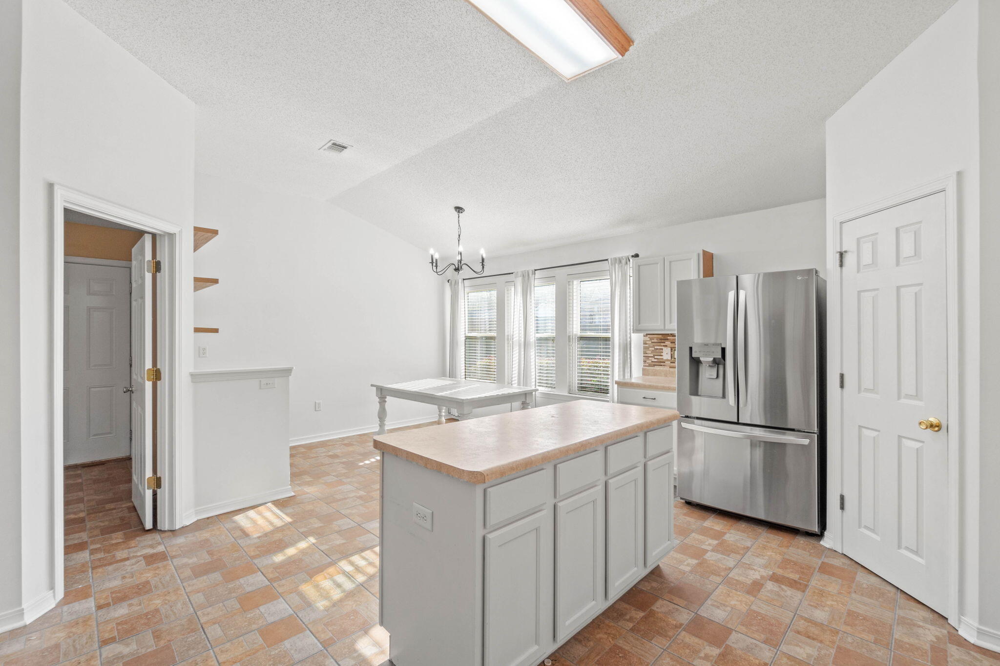 3128 Border Creek Drive Crestview, FL 32539 - Photo 10 of 23 a kitchen with stainless steel appliances granite countertop a refrigerator and a sink