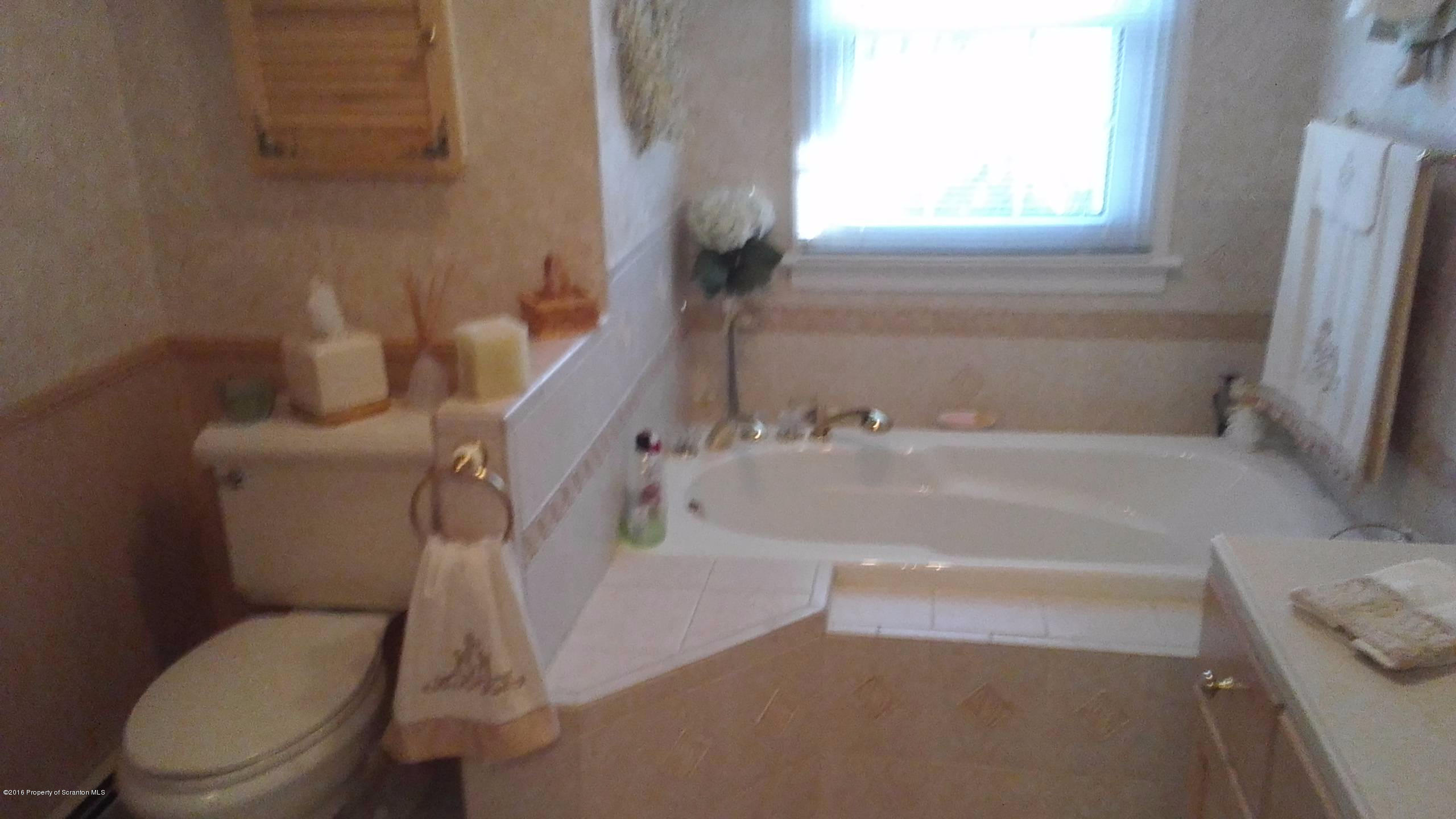 3225 Major Road Moscow, PA 18444 - Photo 12 of 27 a bathroom with a sink and a toilet