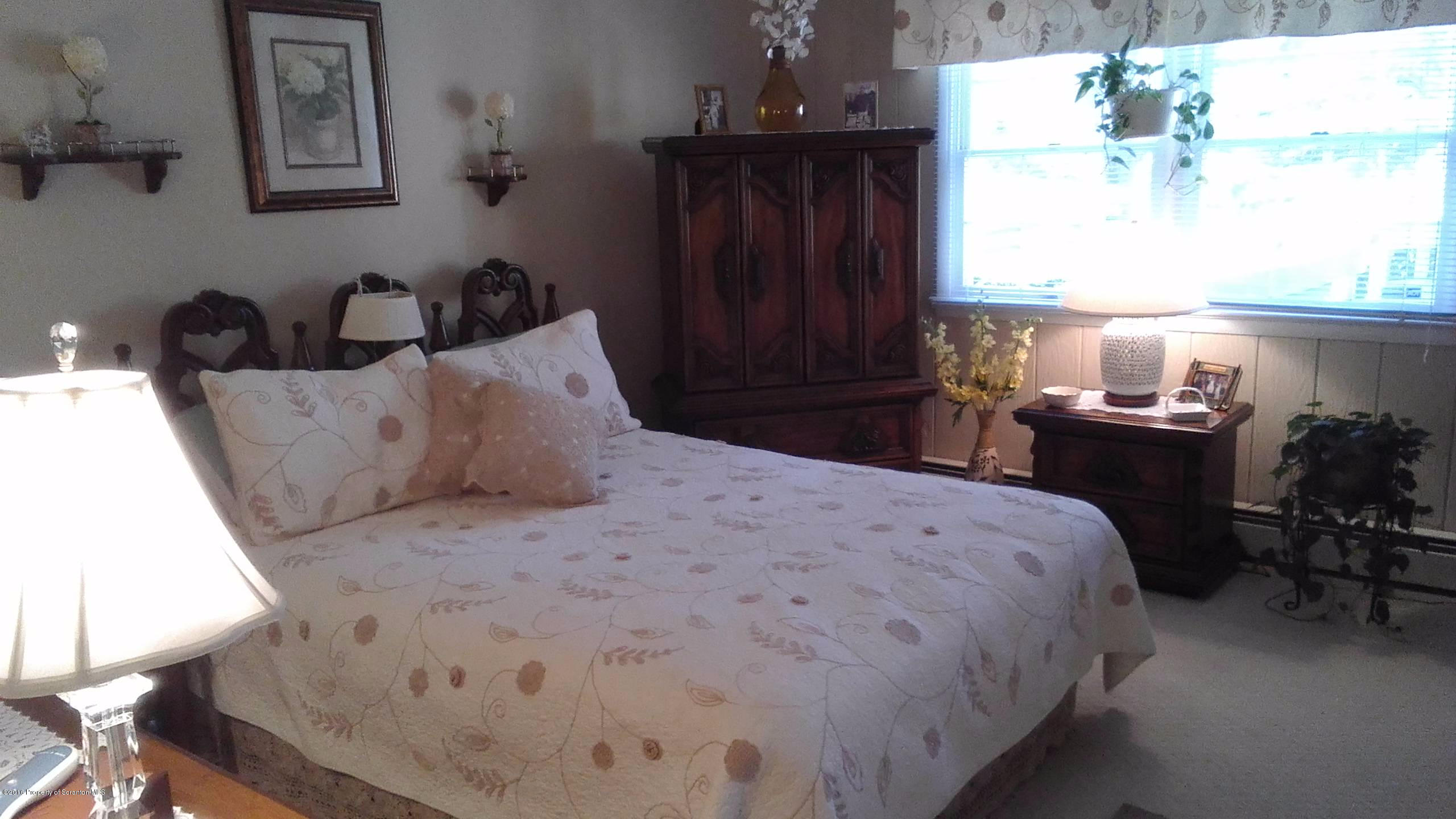 3225 Major Road Moscow, PA 18444 - Photo 15 of 27 a bedroom with a bed and a window