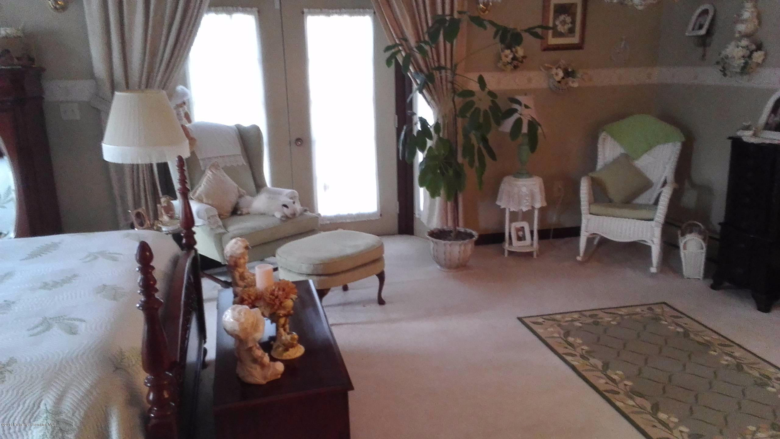 3225 Major Road Moscow, PA 18444 - Photo 17 of 27 a living room with furniture and a lamp