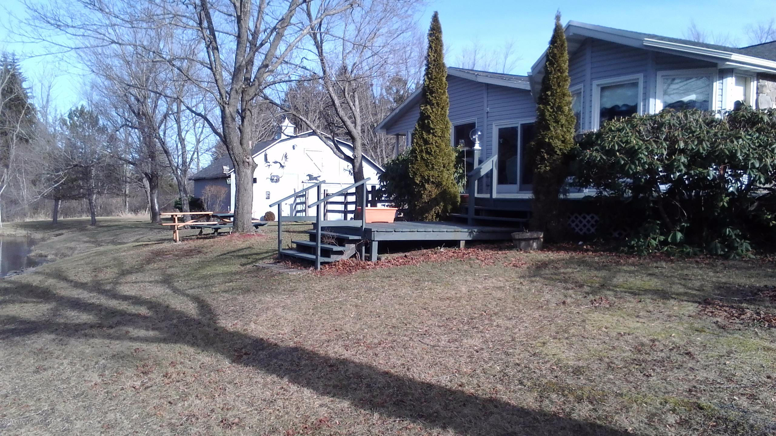 3225 Major Road Moscow, PA 18444 - Photo 19 of 27 a view of a house with a yard and sitting area