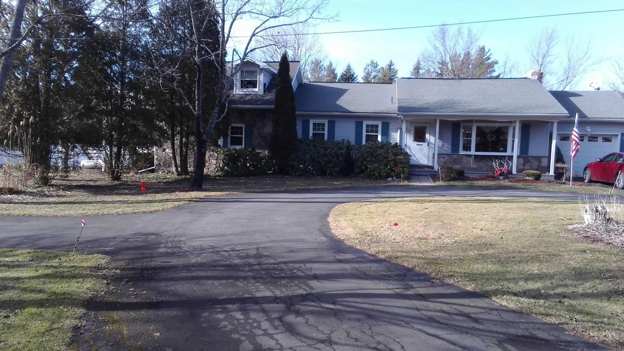 3225 Major Road Moscow, PA 18444 - Photo 2 of 27 a view of a house with a swimming pool