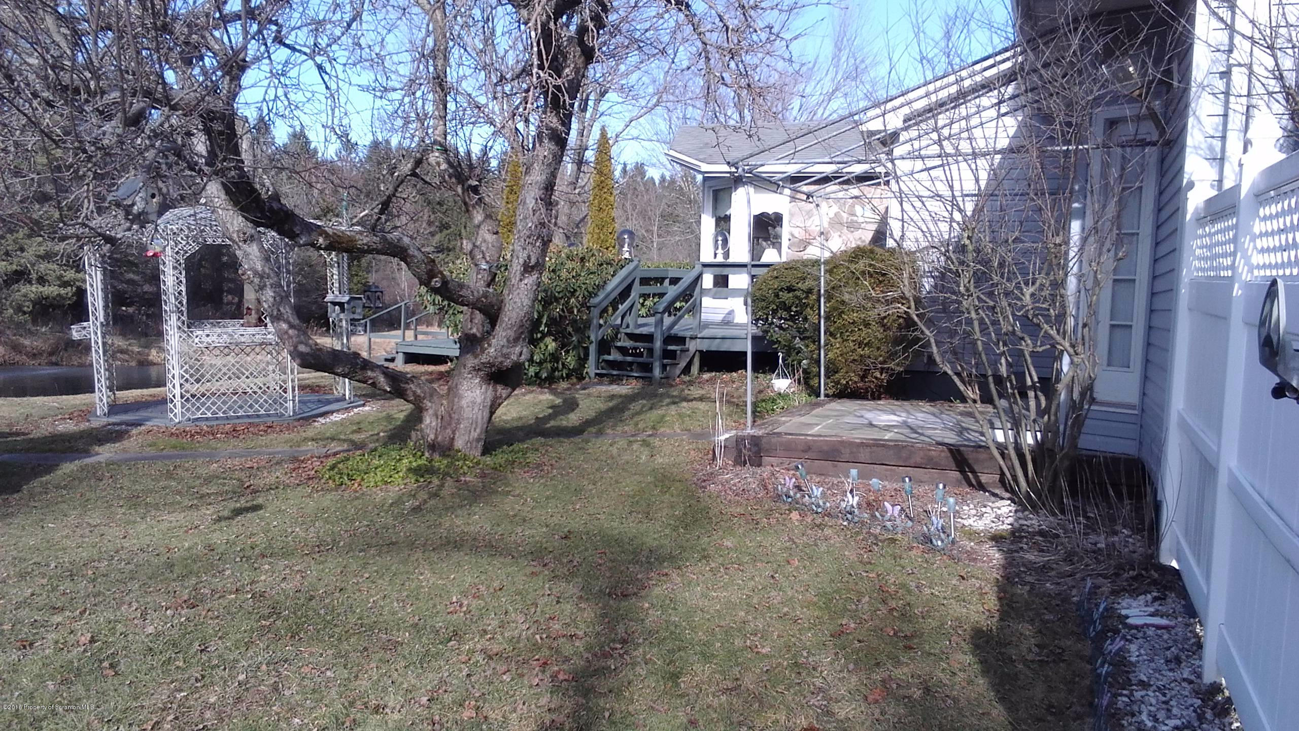 3225 Major Road Moscow, PA 18444 - Photo 23 of 27 a backyard of a house with lots of green space