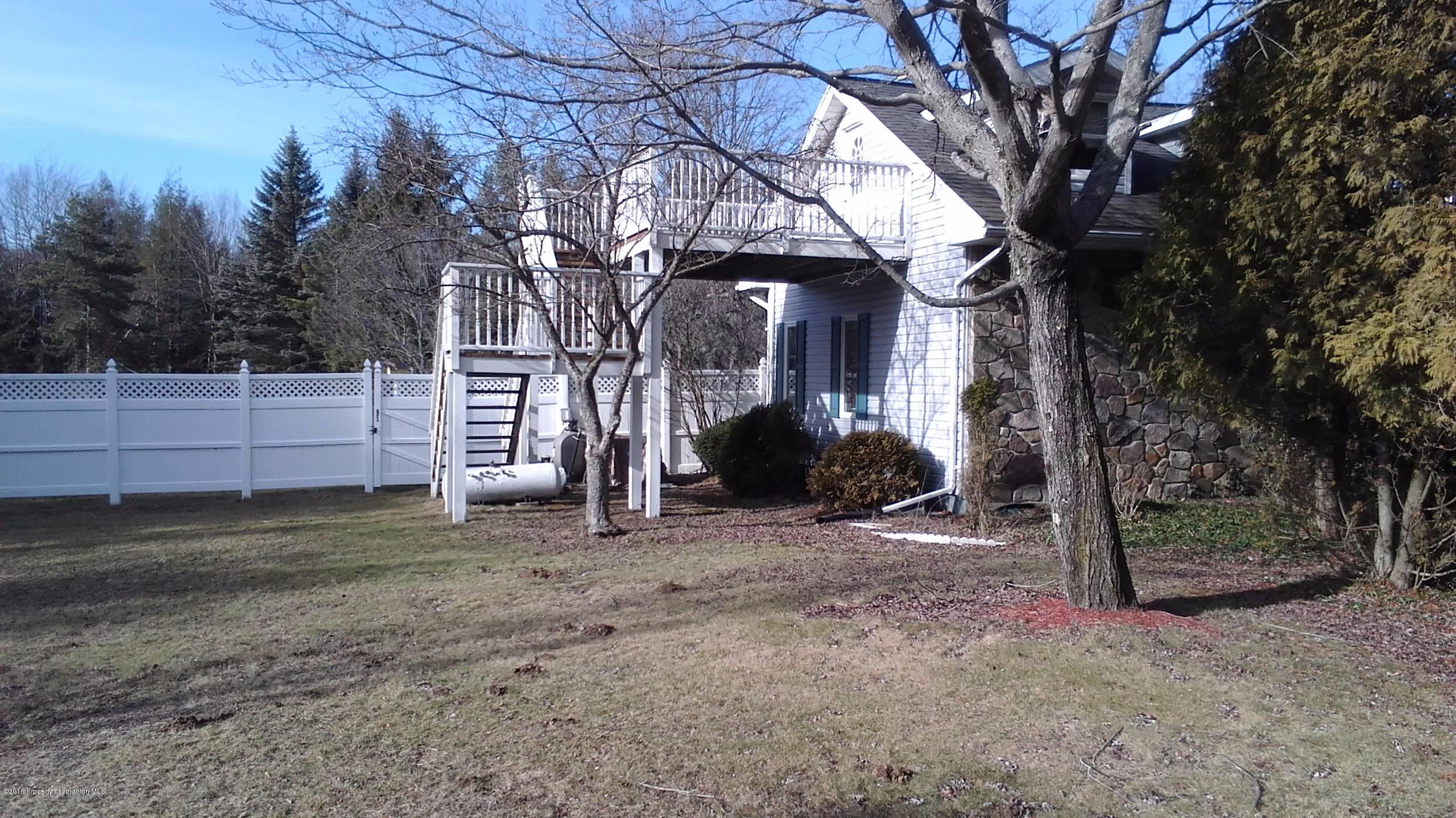 3225 Major Road Moscow, PA 18444 - Photo 27 of 27 a view of a house with a yard