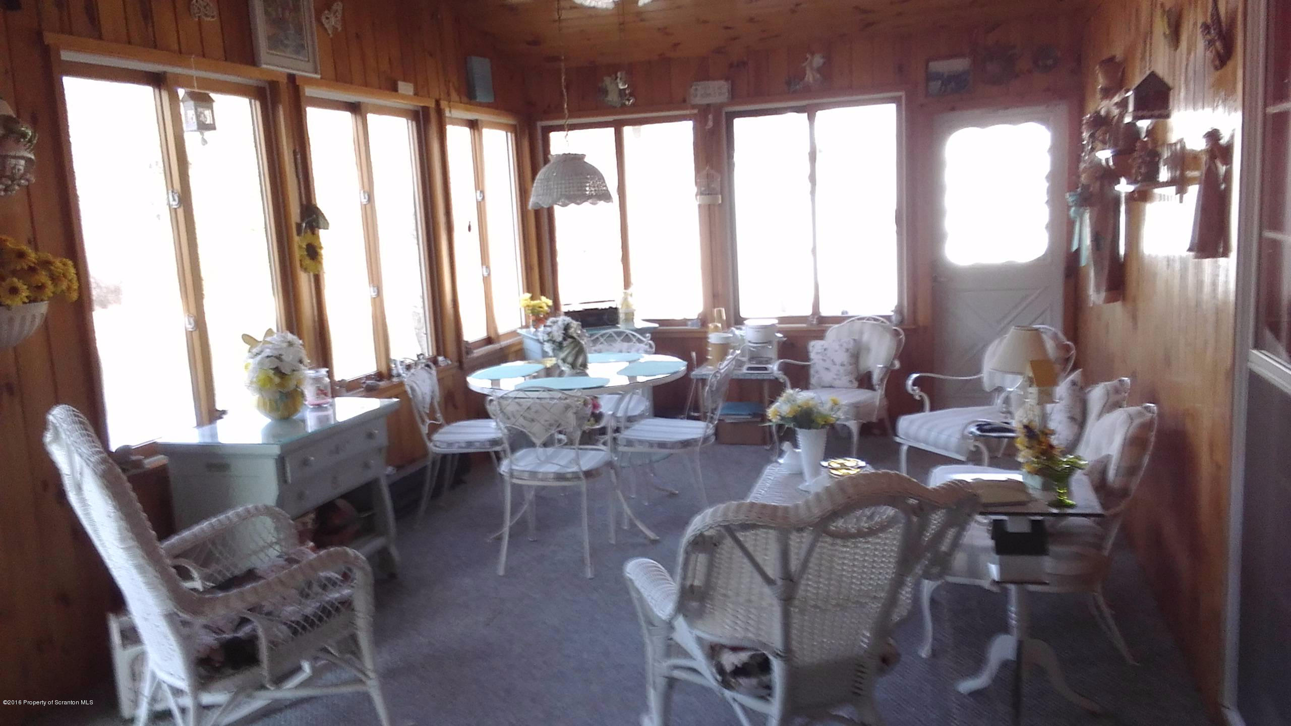 3225 Major Road Moscow, PA 18444 - Photo 10 of 27 a living room with furniture and large windows