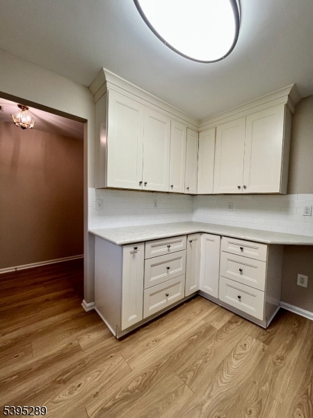 133 Mockingbird Court Three Bridges, NJ 08887 - Photo 5 of 21 a kitchen with granite countertop white cabinets and white appliances