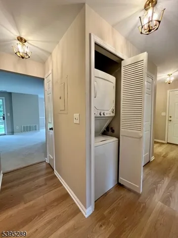 a view of a hallway view with staircase